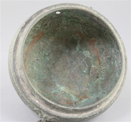 A Chinese archaic bronze tripod vessel base, Dui, Eastern Zhou dynasty, 6th-5th century B.C., 25cm wide, 15cm high, hole, lacking cover